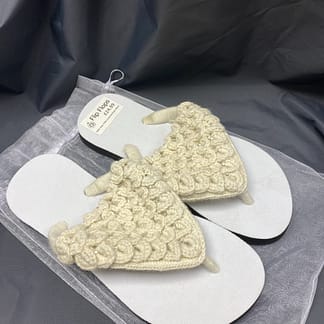 White alpaca flipflops