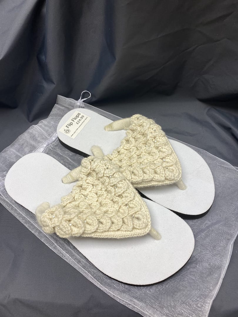 White alpaca flipflops